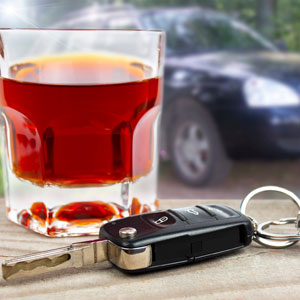 Car key and Alcohol representing DUI case - Sexton Weldon Law Firm.