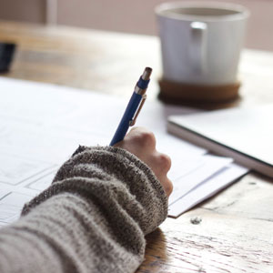 A lady filling the legal document - Sexton Weldon Law Firm.