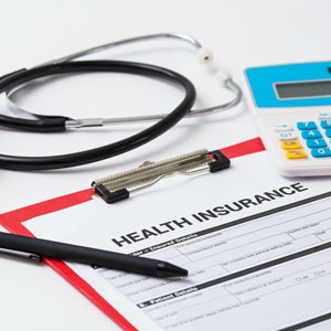 A stethoscope and health insurance form - Sexton Weldon Law Firm.