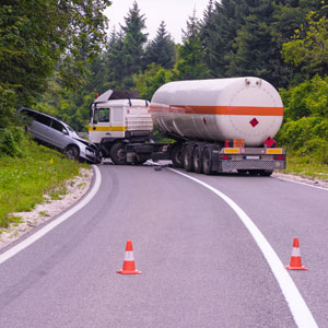 A large tanker truck involved in an accident with a car - Sexton Weldon Law Firm