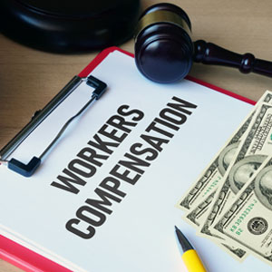 Workers Compensation document with a gavel, dollar bills, and a pen symbolizing Workers’ Compensation Case Worth - Sexton Weldon Law Firm