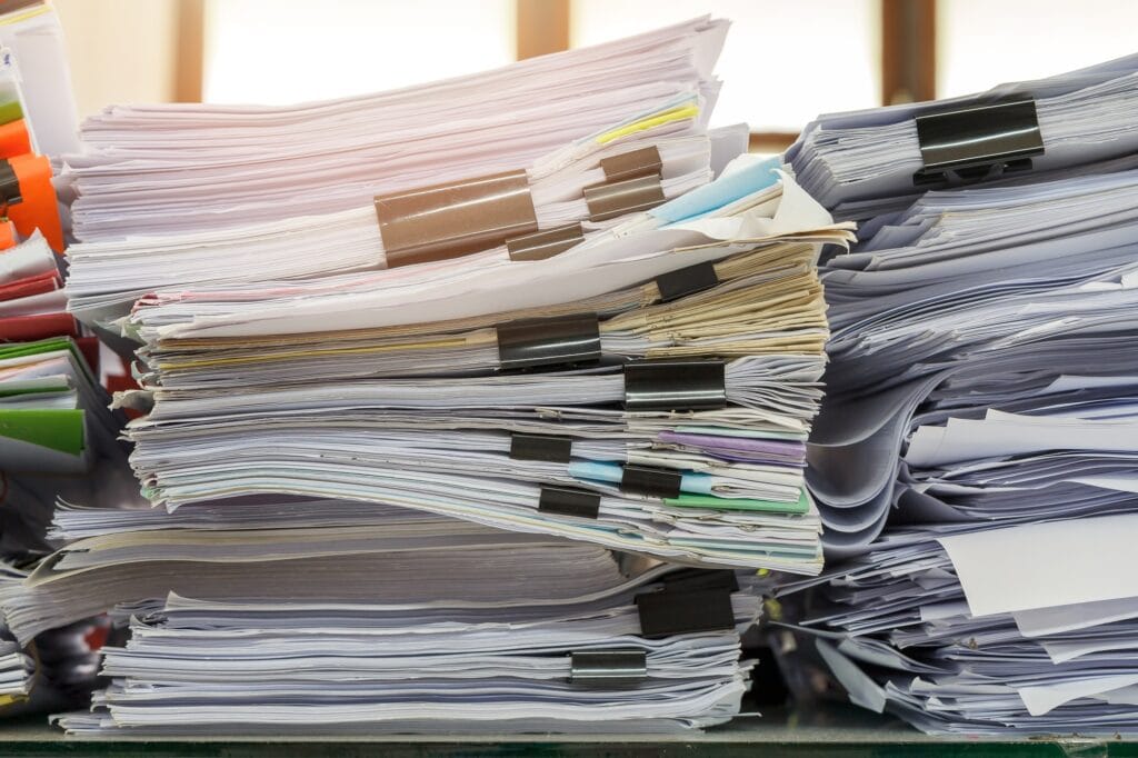 Close up of business documents stack on desk , report papers stack