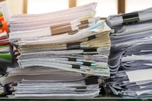 Close up of business documents stack on desk , report papers stack