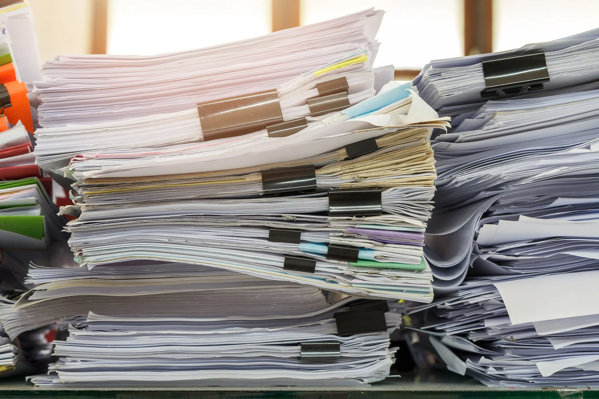 Close up of business documents stack on desk , report papers stack